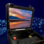 a computer in pelican case with the monitor illuminated